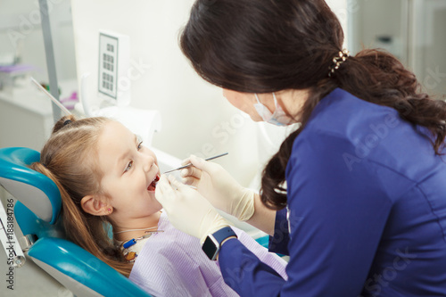 Wallpaper Mural Child lies in dentist chair and goes through procedure Torontodigital.ca