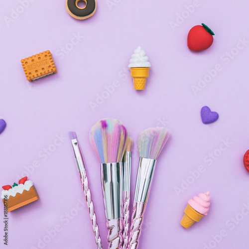 colorful make-up brushes  among the desserts