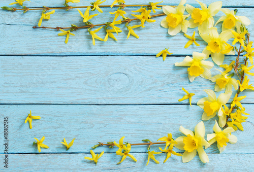 Spring yellow flowers in the old  wooden background