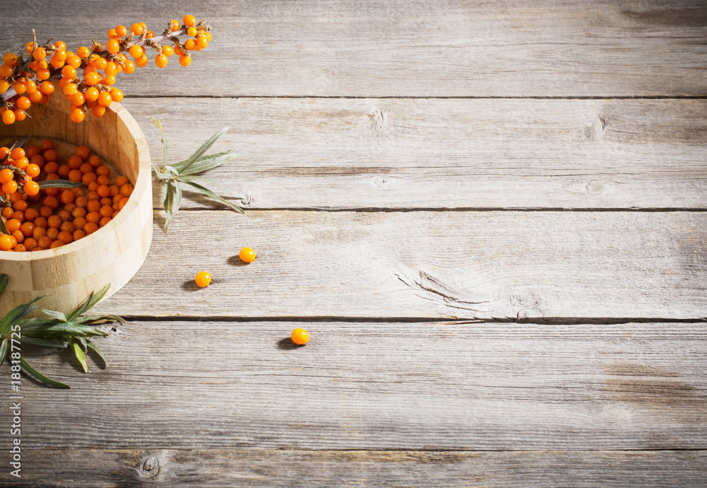 sea buckthorn on wooden background sea buckthorn on wooden background