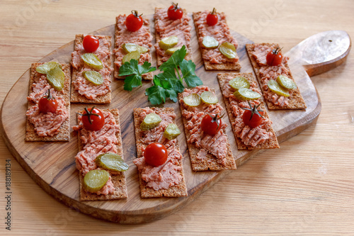 appetizer, bread with meat pate on a cutting Board