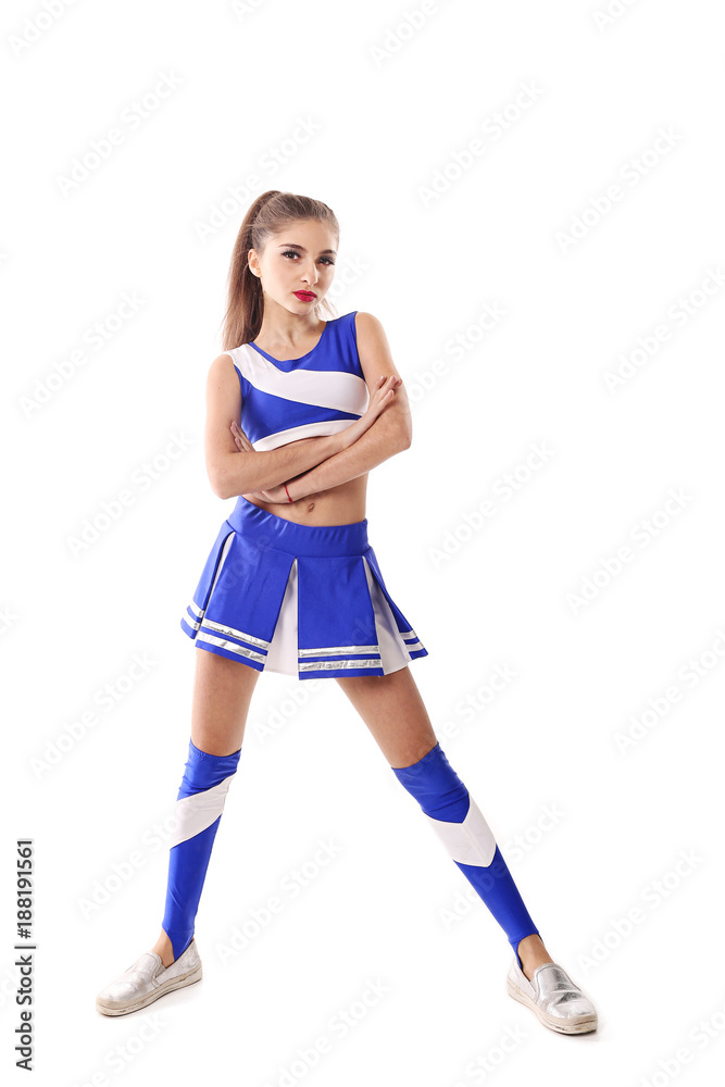Young cheerleader in blue and white suit on white background. Isolated on white background. Young cheerleader in blue and white suit on white background. Isolated on white background.