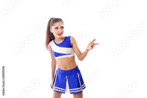 Young cheerleader in blue and white suit on white background. Isolated on white background. © Marina Varnava