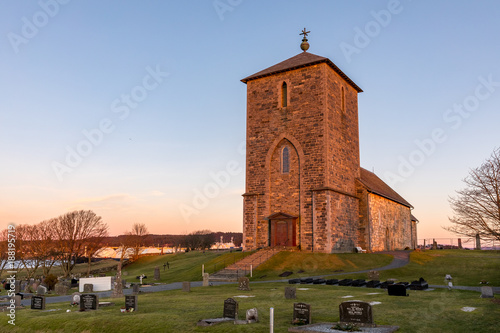 The medieval stone church at Avaldsnes, on the Island of Karmoy, Norway, vertical image of the front entrance and stairs