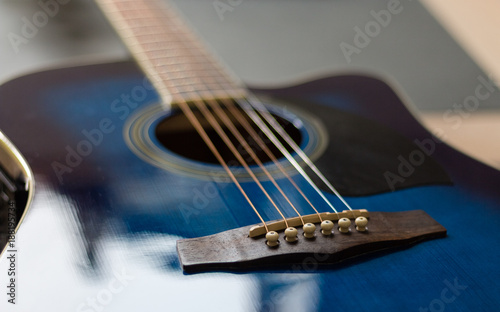 Acoustic guitar blue with shallw depth of field