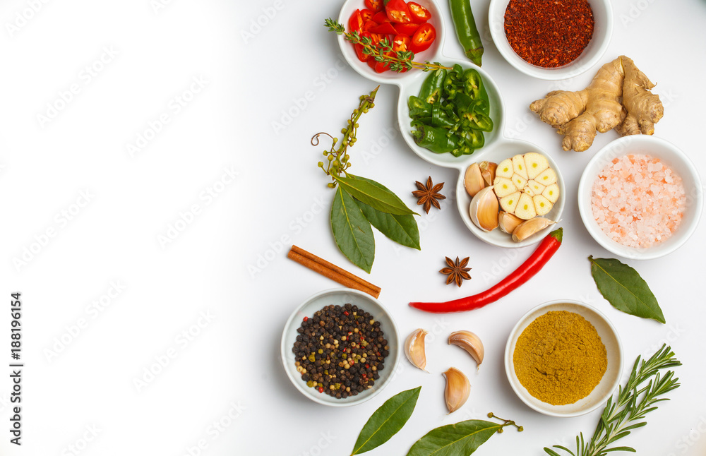 Selection of spices herbs and greens. Ingredients for cooking. White background, top view, copy space.