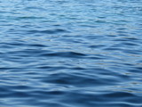 Deep blue sea water surface texture - ripple water background