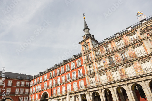 Detail of a decorated facade with traditional windows and balconies at the Palza Mayor, Madrid, Spain. photo