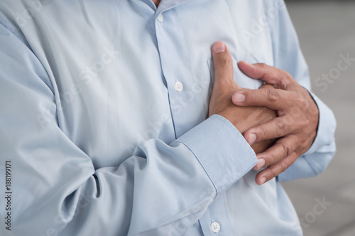 senior old man heart attack, hand holding chest © 9nong