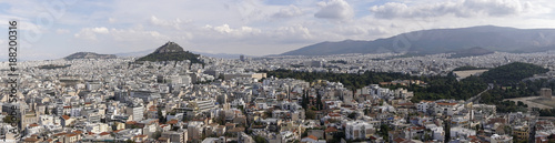 Athens, Greece day view ranging from Mount Lycabettus to Panathenaic Stadium. Panoramic view of Lykavittos hill, The Greek Parliament in the center and to the far right the Temple of Olympian Zeus.