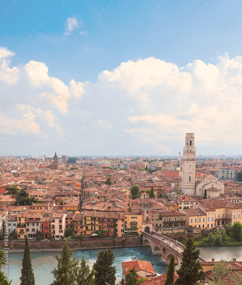 Verona, Italy. Aerial view with Adige River and Ponte di Pietra at summer day with blue sky. Panorama. Ancient european Italian city.