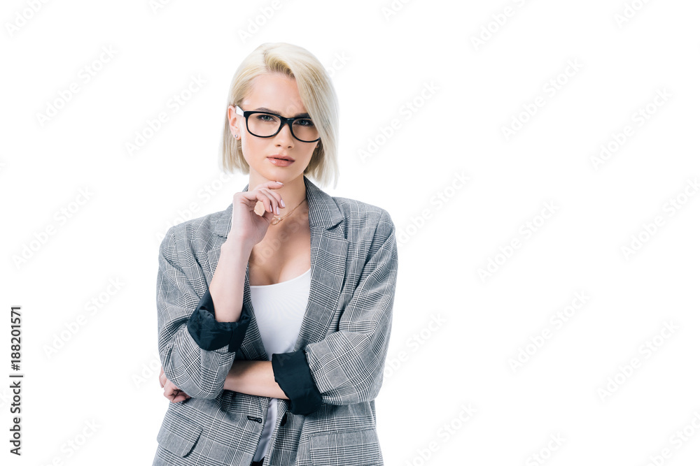pensive businesswoman posing in formal wear, isolated on white