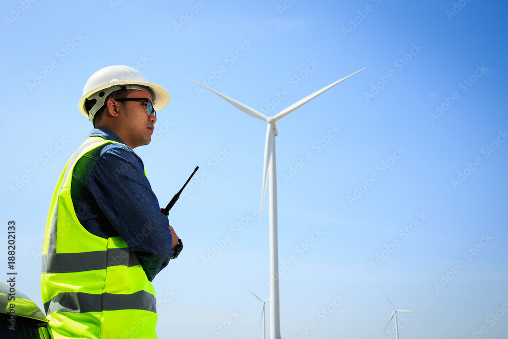 Engineers are investigating the wind turbine. Engineers are investigating the wind turbine.