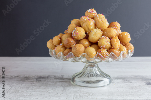 Struffoli - Traditional Neapolitan Dessert Served at Christmas and Easter.  Honey Glazed, Fried, dough Balls