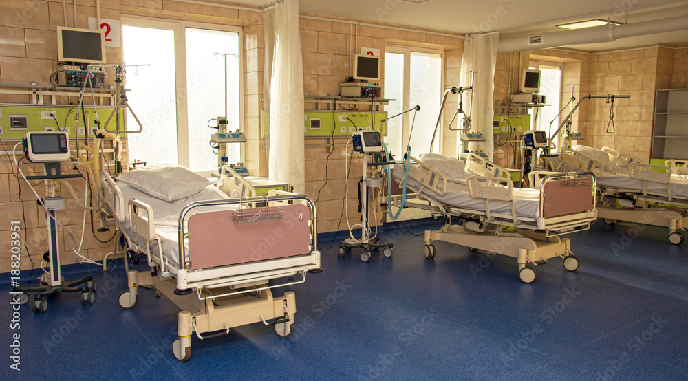modern medical bed and a special device in the modern ward of resuscitation in the hospital (patient recovery, death - concept)
