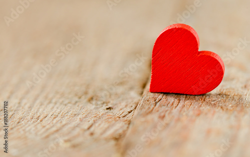 Heart on a wooden background. Background in the style of Valentine s Day. Heart on a wooden background