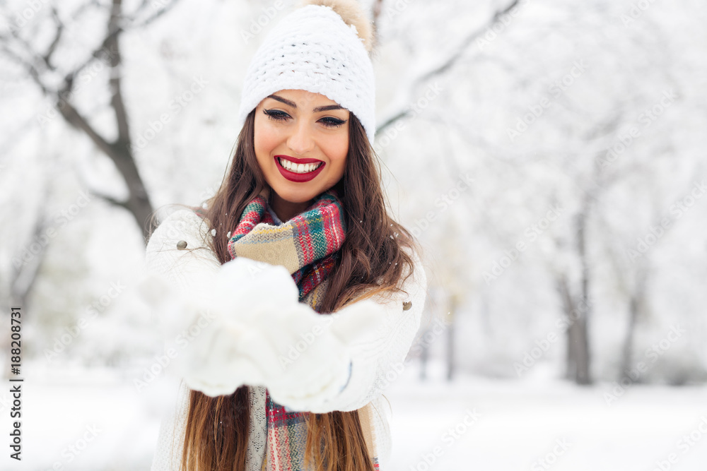 Attractive young woman in wintertime outdoor