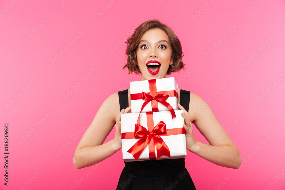 Fototapeta premium Portrait of a cheery girl dressed in dress