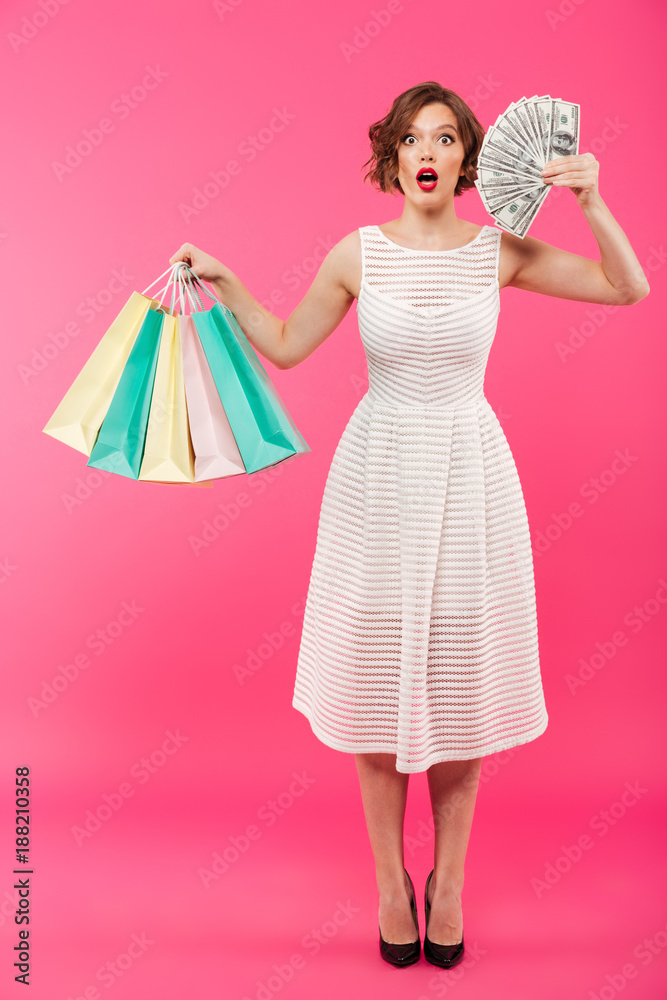 Full length portrait of a surprised girl dressed in dress Full length portrait of a surprised girl dressed in dress