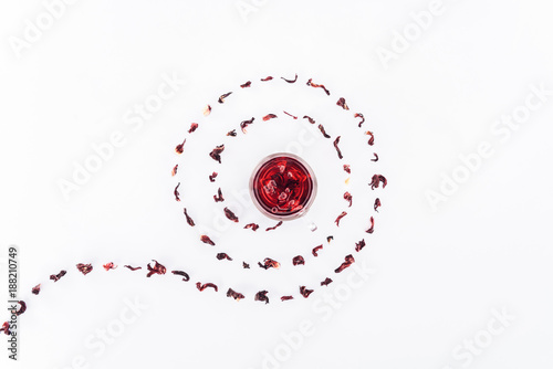 top view of cup with hibiscus tea in spiral isolated on white