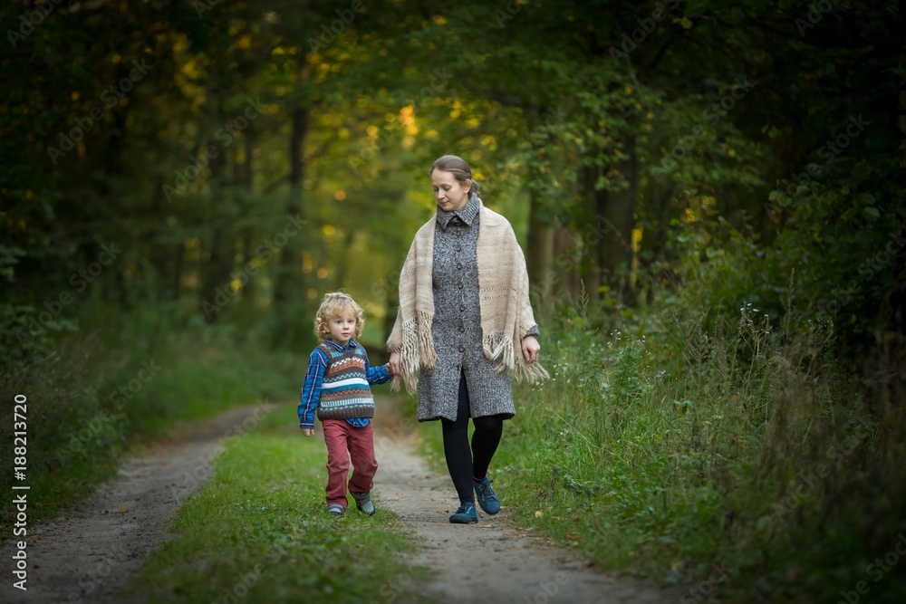 Fototapeta premium Mother and son together in forest