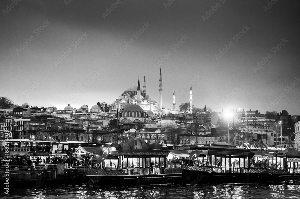 Black and white Istanbul city view with Suleymaniye mosque from Galata Bridge at night