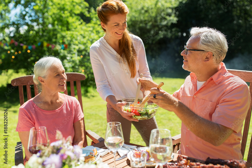 happy family having dinner or summer garden party happy family having dinner or summer garden party