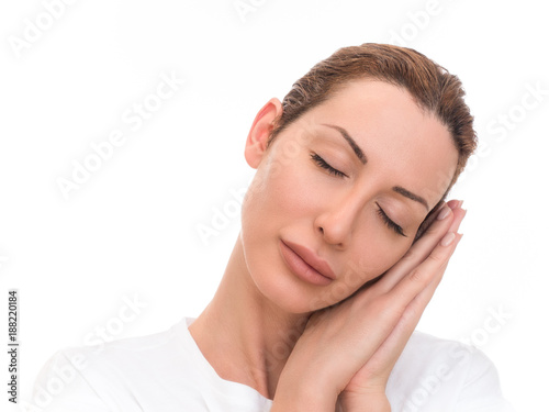 Portrait of beautiful girl sleeping on hands. Isolated on white background.