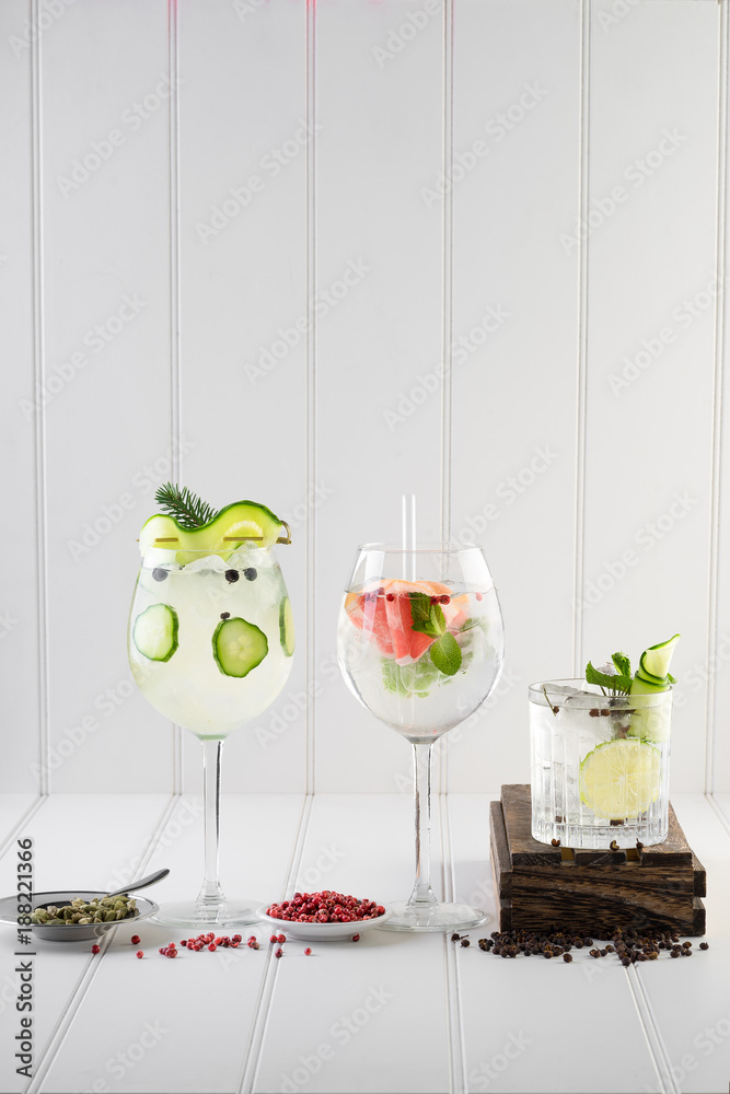 fancy gin and tonic selection drink alcohol cocktail craft fresh fruit spices mint glass bar