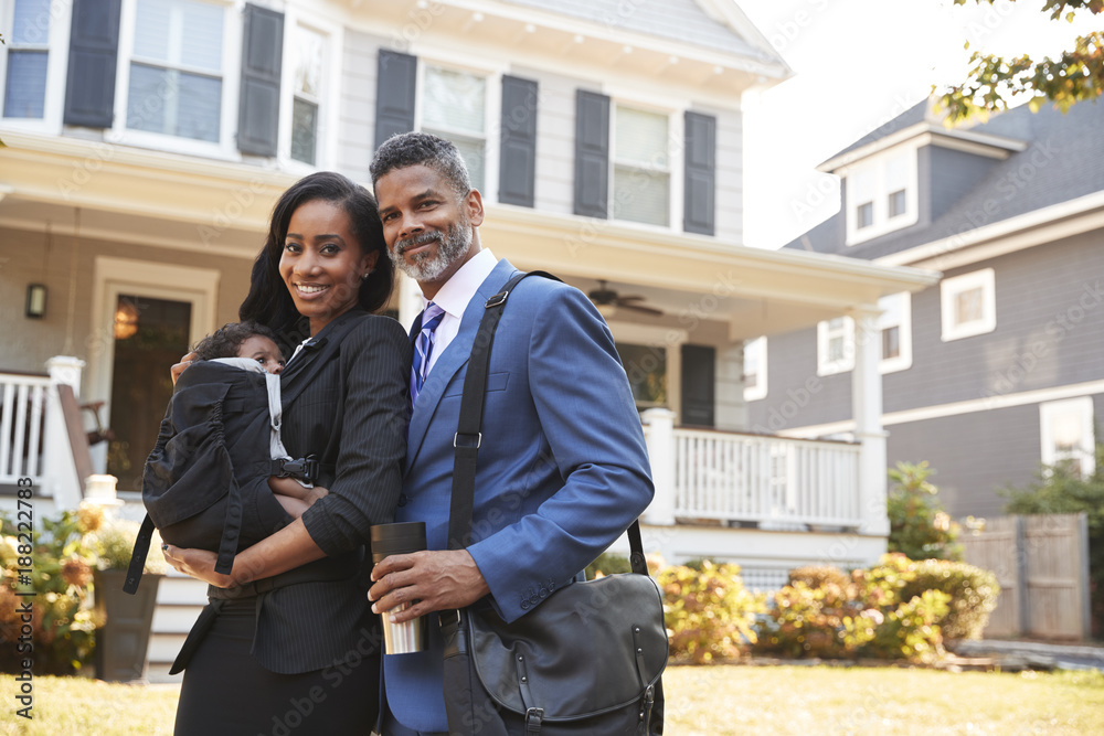 Portrait Of Business Couple With Baby Son Leaving House For Work Portrait Of Business Couple With Baby Son Leaving House For Work