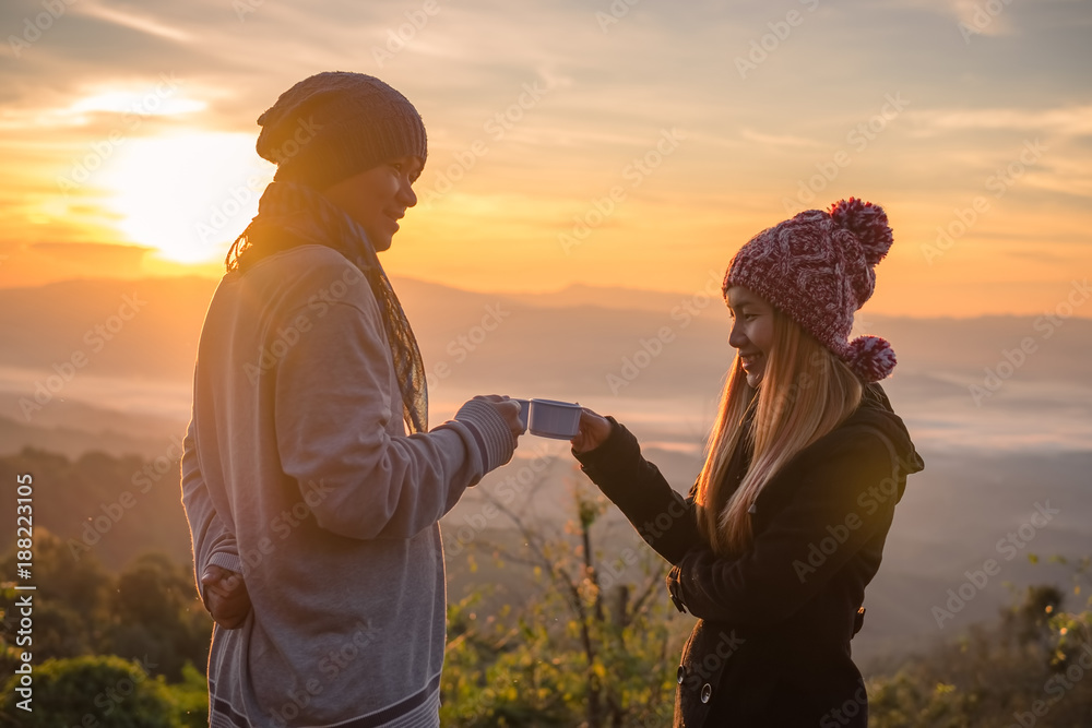 silhouettes of a loving couple hikers on top of the mountain copyspace love anniversary achieving togetherness affection romantic hiking active