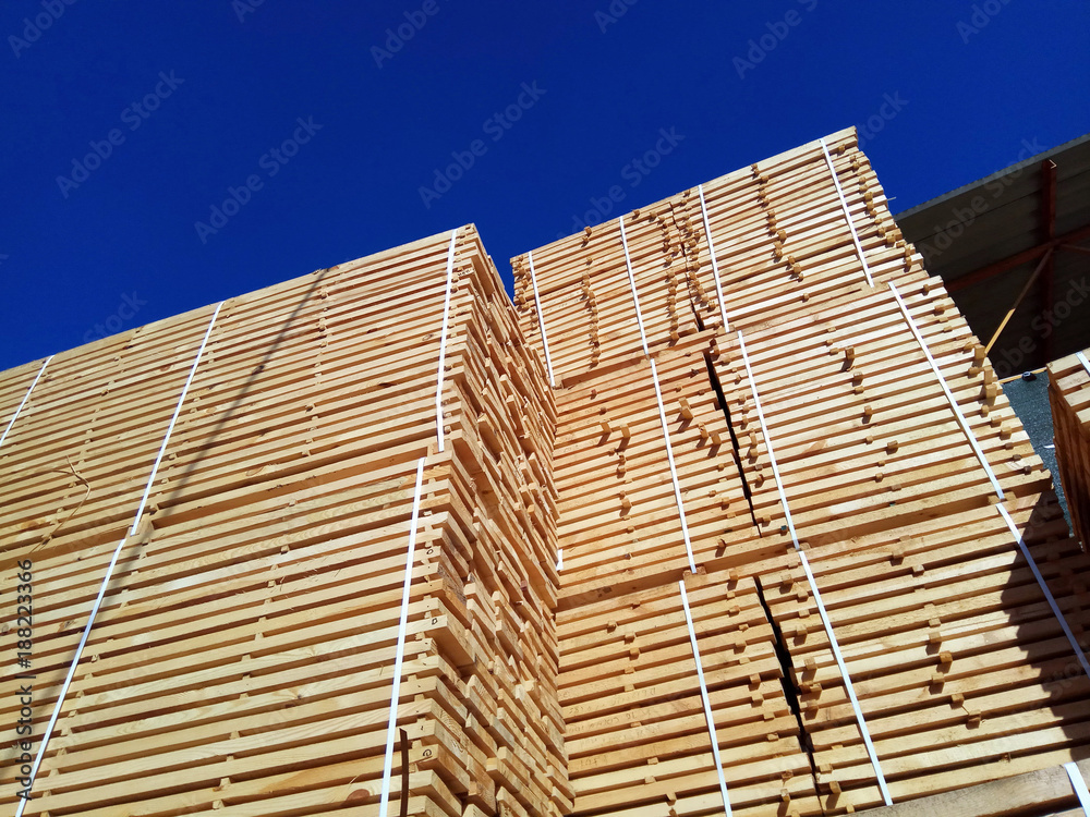 stack of wooden planks at the lumber yard stack of wooden planks at the lumber yard