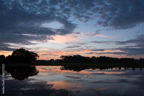 Sunrise Reflecting over Smooth Water