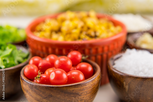 Tiny Cherry Tomatoes in Wooden Bowl
