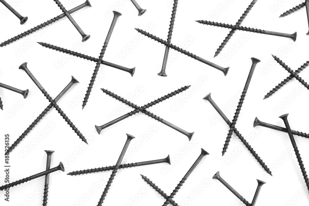 Self-tapping screws chaotically arranged on background Self-tapping screws chaotically arranged on background