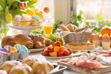 Table with delicatessen ready for Easter brunch