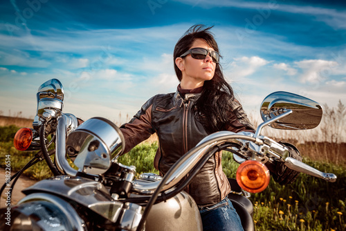 Biker girl sitting on motorcycle © Andrei Armiagov