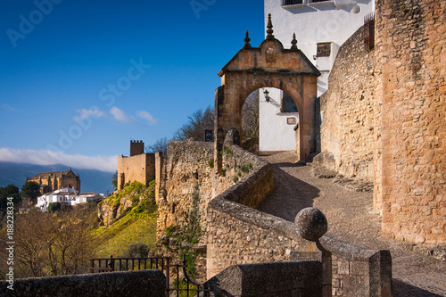 Ronda, Malaga province, Andalusia, Spain - arch of Felipe V with old Arab bridge
