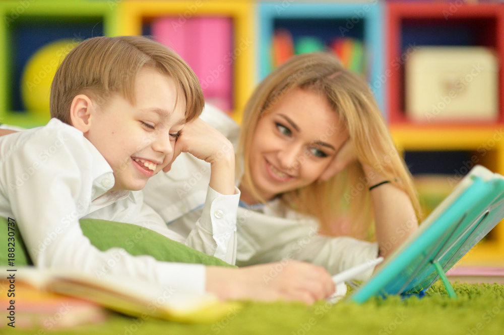 Mother with her son doing homework Mother with her son doing homework