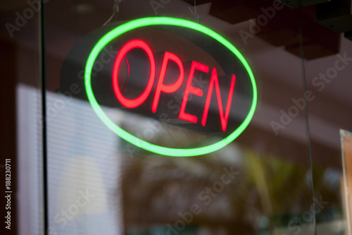 Open for business and ready for customers. Close-up shot of a bright neon sign at an eatery.