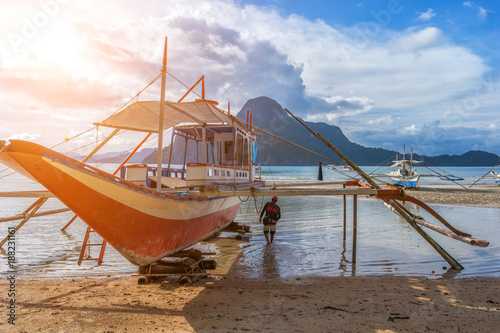 Bangka boat is standing on the beach at sunset  Philippines