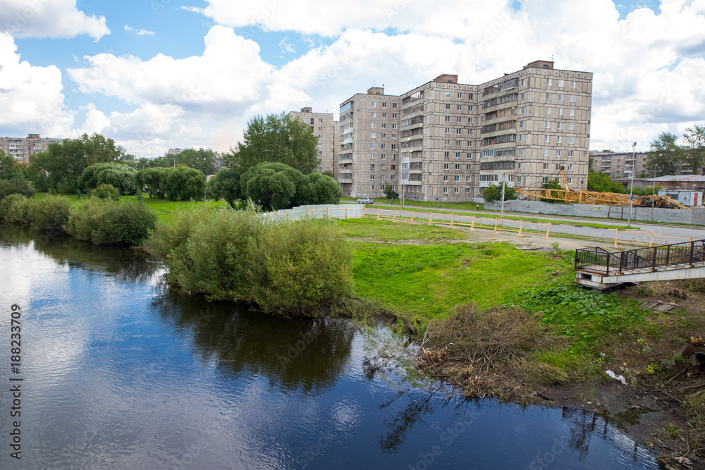 Residential multi-storey houses on the river bank Residential multi-storey houses on the river bank