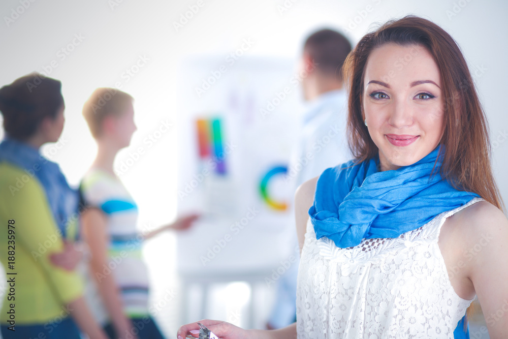 Portrait of attractive female designer in office. female designer Portrait of attractive female designer in office. female designer