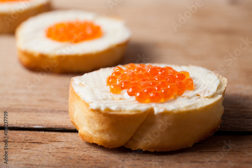Butter with red caviar close up