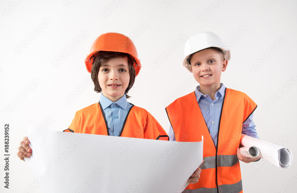 Portrait of happy friends trying on the role of superintendents. Isolated on background Portrait of happy friends trying on the role of superintendents. Isolated on background