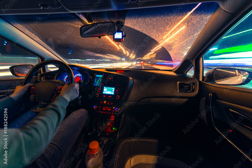 Movement of the car at night at a speed view from the interior, Brilliant road with lights with a car at high speed Movement of the car at night at a speed view from the interior, Brilliant road with lights with a car at high speed