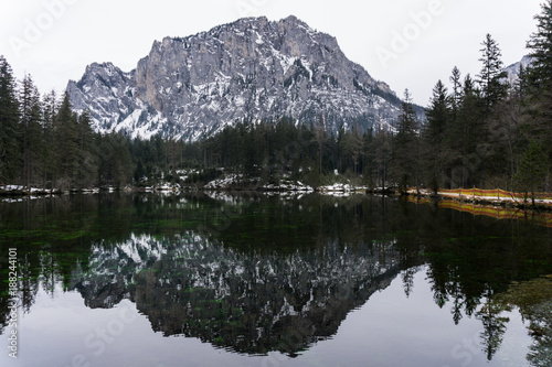 Beautiful lake reflecting the majestic Alps behind it