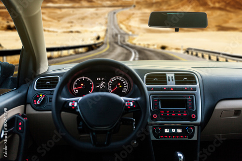 Car interior front dashboard © George Dolgikh