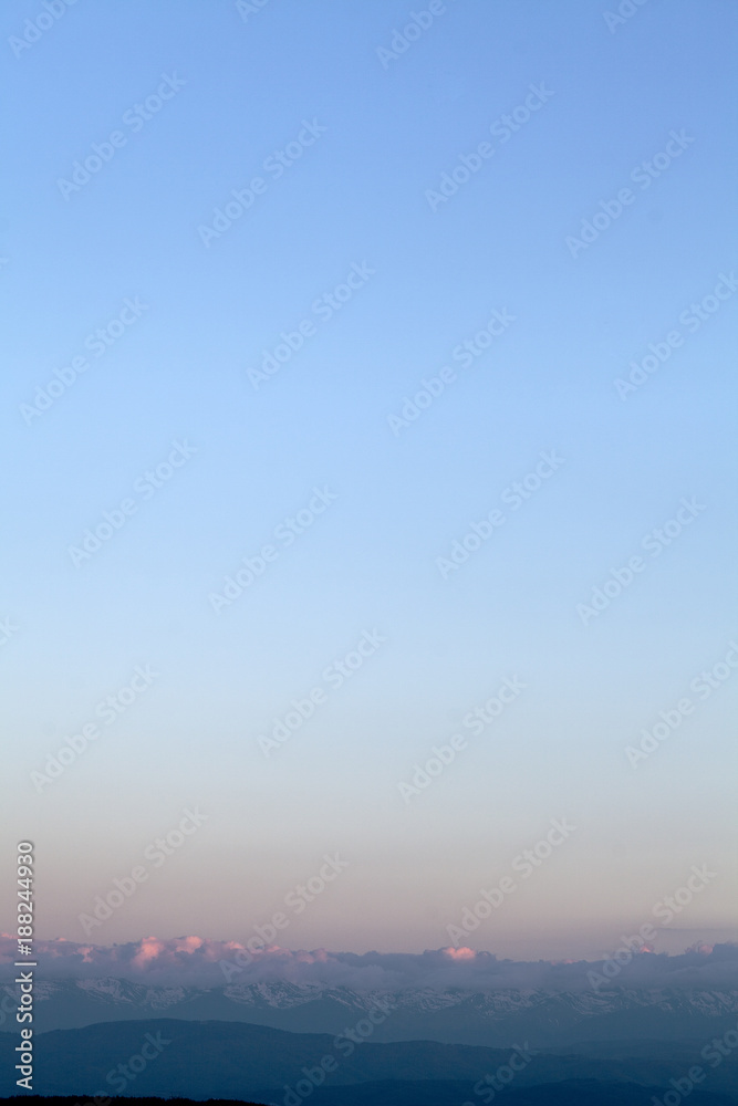 Fototapeta premium pink clouds over the horizon on sunrise