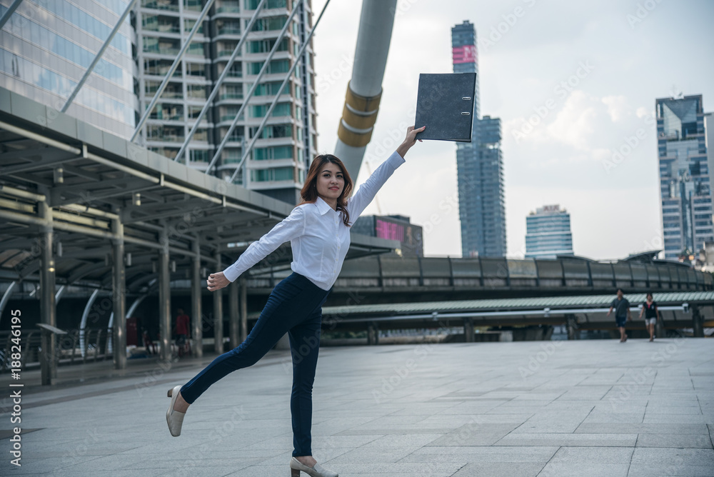 Portraits of beautiful asian woman look confidence is standing and holding document folder. concept of setting business goals. Portraits of beautiful asian woman look confidence is standing and holding document folder. concept of setting business goals.